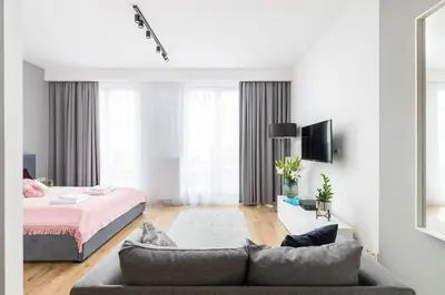 Łóżko lub łóżka w pokoju w obiekcie Sławińska 6 with Balcony by Noclegi Renters