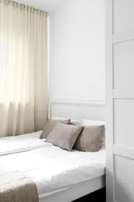 Łóżko lub łóżka w pokoju w obiekcie Warsaw Concierge Waszyngtona Park