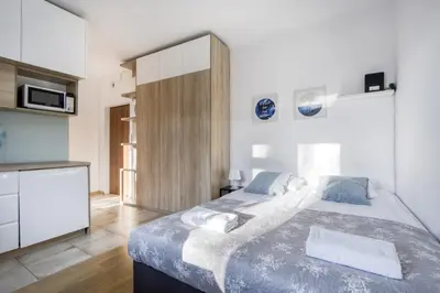 Łóżko lub łóżka w pokoju w obiekcie Labo Apartment Solidarnosci