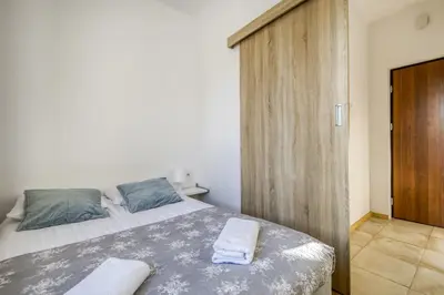 Łóżko lub łóżka w pokoju w obiekcie Labo Apartment Solidarnosci
