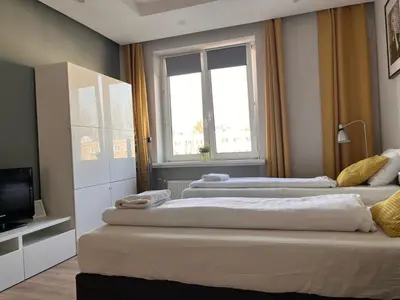 Łóżko lub łóżka w pokoju w obiekcie Labo Apartment Solidarnosci
