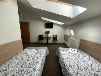 Łóżko lub łóżka w pokoju w obiekcie Hotelik Gold