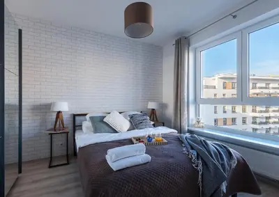 Łóżko lub łóżka w pokoju w obiekcie P&O Serviced Apartments Group Komputerowa
