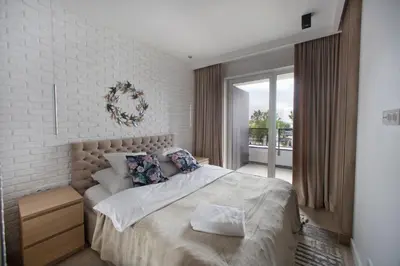 Łóżko lub łóżka w pokoju w obiekcie P&O Serviced Apartments Group Komputerowa