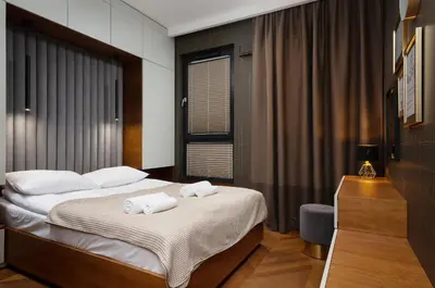 Łóżko lub łóżka w pokoju w obiekcie Apartments Konstruktorska by Renters Prestige