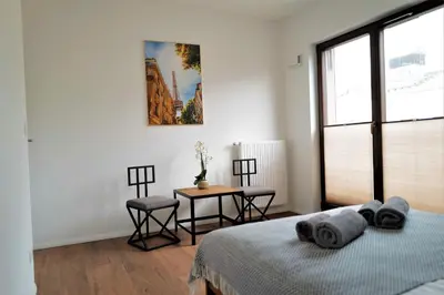 Łóżko lub łóżka w pokoju w obiekcie Central Port Warsaw Apartment