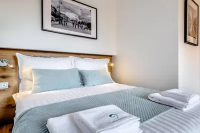 Łóżko lub łóżka w pokoju w obiekcie Koszykowa Suite - apartament w centrum Warszawy!