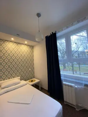 Łóżko lub łóżka w pokoju w obiekcie Pastel Guest Rooms