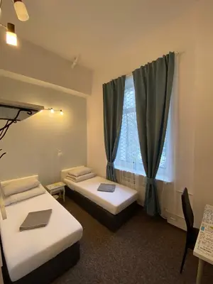 Łóżko lub łóżka w pokoju w obiekcie Pastel Guest Rooms