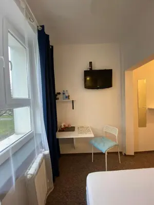 Telewizja i/lub zestaw kina domowego w obiekcie Pastel Guest Rooms