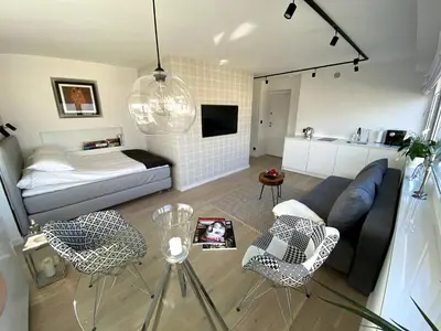 Łóżko lub łóżka w pokoju w obiekcie Leo Apartment