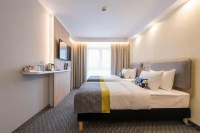 Łóżko lub łóżka w pokoju w obiekcie Holiday Inn Express Warsaw - Mokotow by IHG