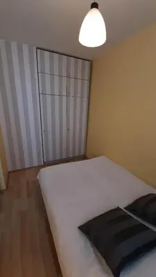 Łóżko lub łóżka w pokoju w obiekcie W samym Centrum na Grzybowskiej