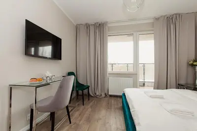 Łóżko lub łóżka w pokoju w obiekcie Warsaw To Be - Silver Apartment
