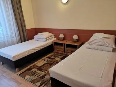 Łóżko lub łóżka w pokoju w obiekcie Hotel Duka