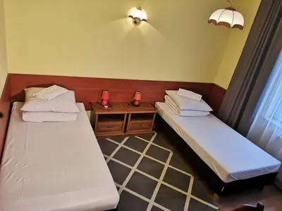 Łóżko lub łóżka w pokoju w obiekcie Hotel Duka