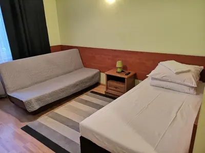 Łóżko lub łóżka w pokoju w obiekcie Hotel Duka