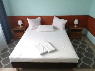 Łóżko lub łóżka w pokoju w obiekcie Hotel Duka
