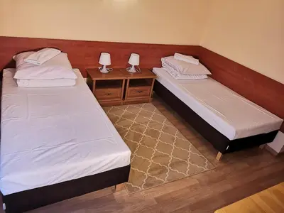Łóżko lub łóżka w pokoju w obiekcie Hotel Duka