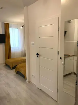 Łóżko lub łóżka w pokoju w obiekcie Apartamenty Brzeska 10