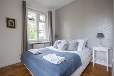 Łóżko lub łóżka w pokoju w obiekcie Ego Apartments Old Town II