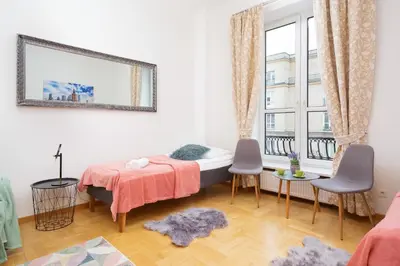Łóżko lub łóżka w pokoju w obiekcie Apartments Warsaw Warecka by Noclegi Renters