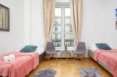 Łóżko lub łóżka w pokoju w obiekcie Apartments Warsaw Warecka by Noclegi Renters