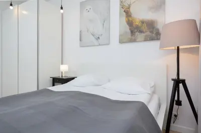 Łóżko lub łóżka w pokoju w obiekcie Apartment Warsaw Żoliborz by Noclegi Renters