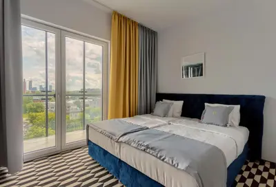 Łóżko lub łóżka w pokoju w obiekcie Apartamenty Prymasa Residence