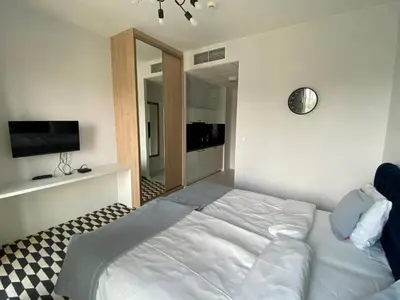 Łóżko lub łóżka w pokoju w obiekcie Apartamenty Prymasa Residence