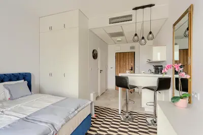 Łóżko lub łóżka w pokoju w obiekcie Apartamenty Prymasa Residence