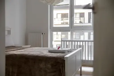 Łóżko lub łóżka w pokoju w obiekcie Rozłogi Sunny Apartment by BookingHost