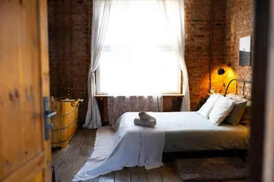 Łóżko lub łóżka w pokoju w obiekcie design LOFT 22