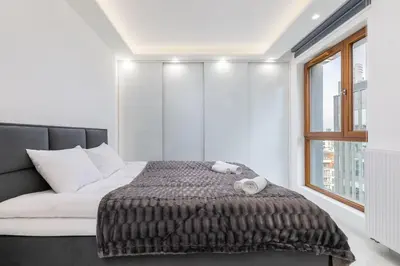 Łóżko lub łóżka w pokoju w obiekcie Karolkowa 28A - Luminous Apartment with Balcony by Renters Prestige