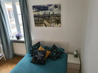 Łóżko lub łóżka w pokoju w obiekcie RentOnline Kościelna Apartment Old Town