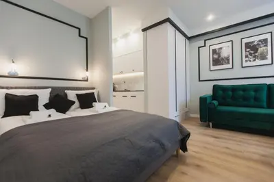 Łóżko lub łóżka w pokoju w obiekcie City Break Atelier Praga Apartamenty