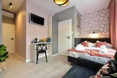 Łóżko lub łóżka w pokoju w obiekcie Candy Apartments Warszawa