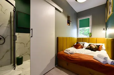 Łóżko lub łóżka w pokoju w obiekcie Candy Apartments Warszawa