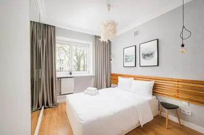 Łóżko lub łóżka w pokoju w obiekcie Stylish Cozy flat in Warsaw center