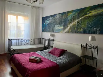 Łóżko lub łóżka w pokoju w obiekcie Beautiful and charming apartment in the heart of the Old Town
