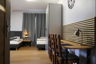 Łóżko lub łóżka w pokoju w obiekcie A&B Willa Klaudyny