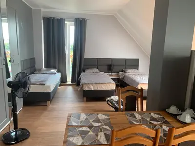 Łóżko lub łóżka w pokoju w obiekcie A&B Willa Klaudyny