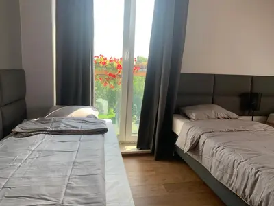 Łóżko lub łóżka w pokoju w obiekcie A&B Willa Klaudyny