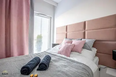Łóżko lub łóżka w pokoju w obiekcie K&K Apartament blisko Centrum Near City Center