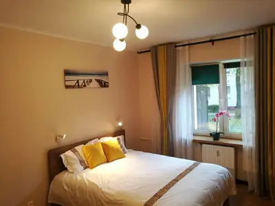 Łóżko lub łóżka w pokoju w obiekcie Travel Apartment