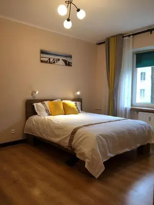 Łóżko lub łóżka w pokoju w obiekcie Travel Apartment