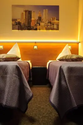 Łóżko lub łóżka w pokoju w obiekcie Villa B&B