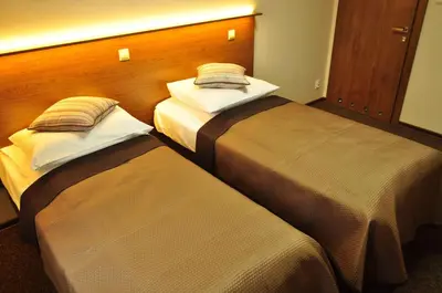 Łóżko lub łóżka w pokoju w obiekcie Villa B&B