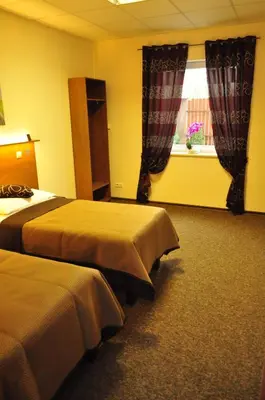 Łóżko lub łóżka w pokoju w obiekcie Villa B&B