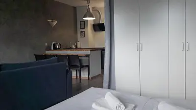 Łóżko lub łóżka w pokoju w obiekcie Silver Apartment in Wilanów